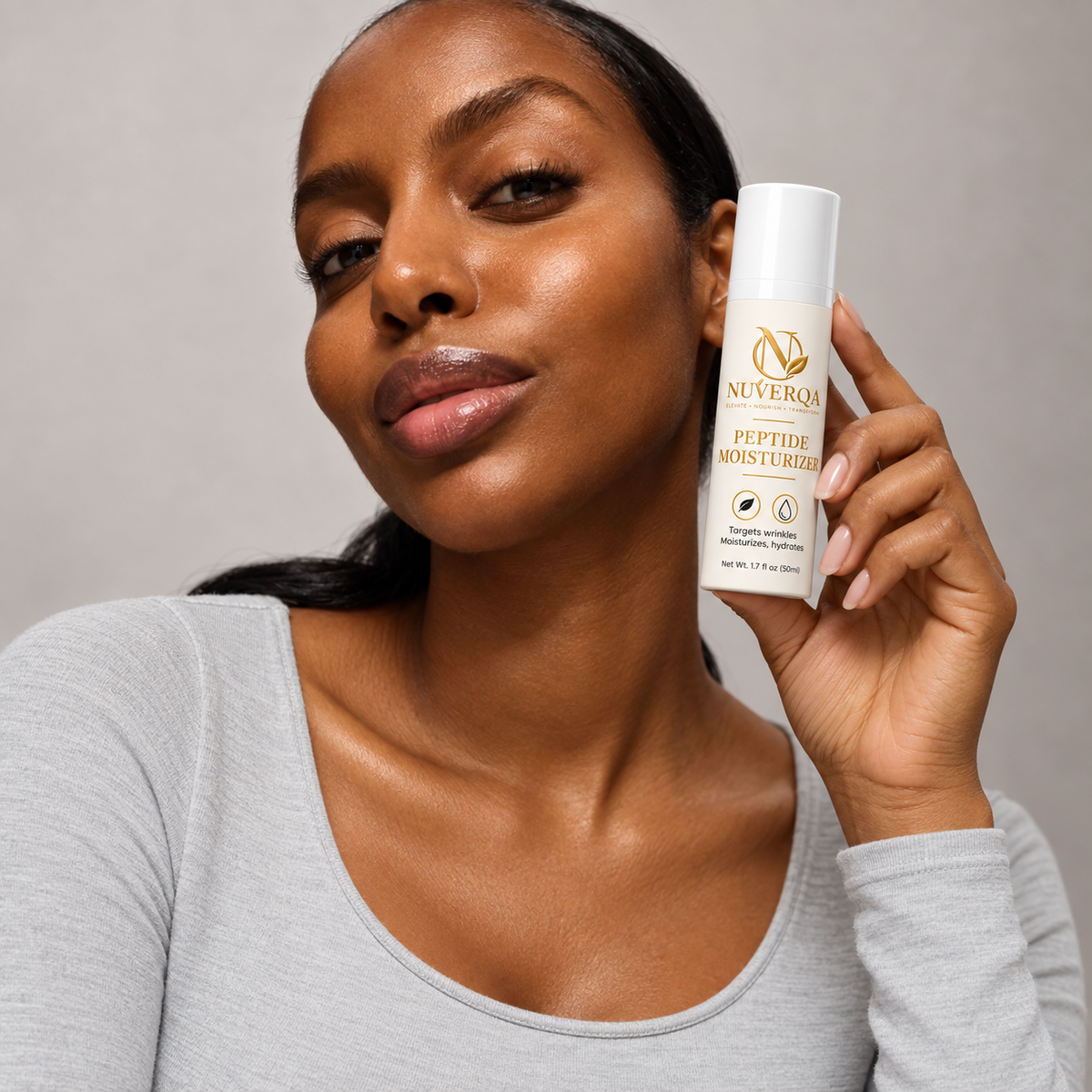 Moisturiser being pressed onto a cheek and jawline